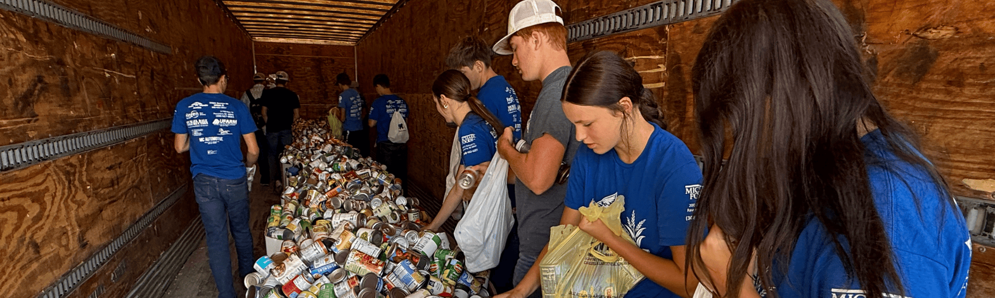 FFA students donate food items during Husker Harvest Days 2025.